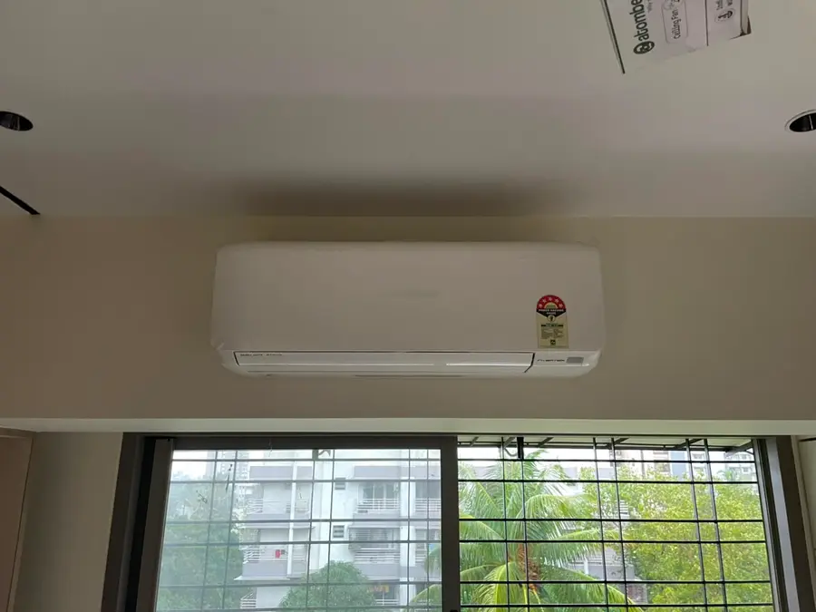 Bright, freshly installed split AC unit representative of the M.K. Ghare Jewellers multi-store rollout