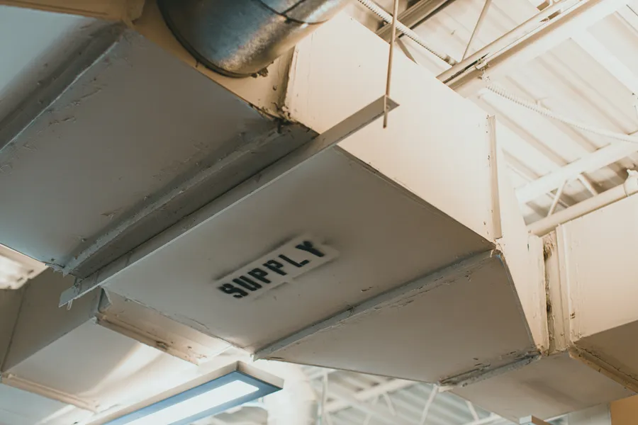 Close-up of ducting supply line during a commercial layout installation