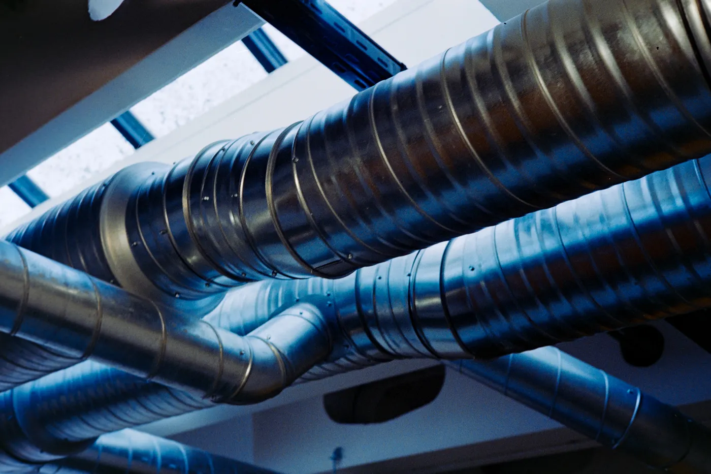 Spiral ducting installed across a commercial ceiling